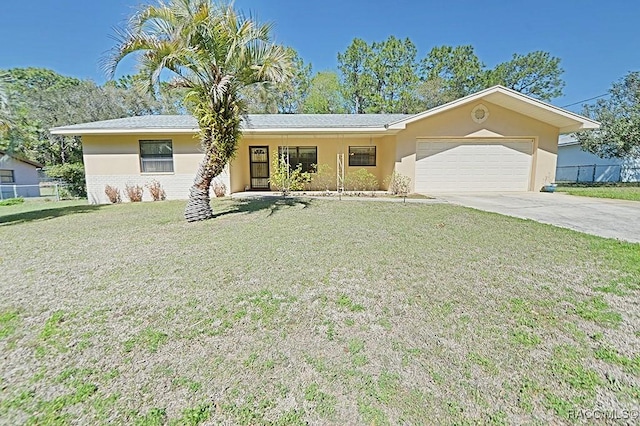 single story home featuring a garage, fence, concrete driveway, stucco siding, and a front yard