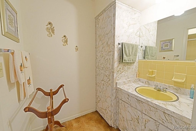 bathroom with backsplash and vanity