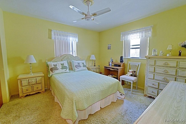 bedroom featuring light carpet and ceiling fan