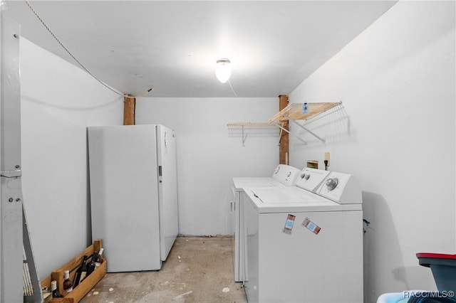 laundry area with independent washer and dryer