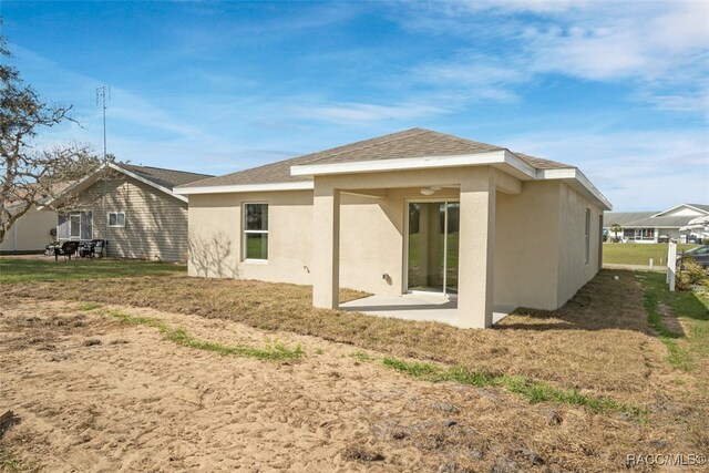 back of property featuring a patio area