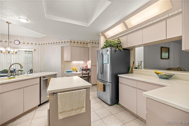9530 SW 189th Ct, Dunnellon, FL 34432 - kitchen featuring appliances with stainless steel finishes, a chandelier, a sink, light countertops, and light tile patterned floors