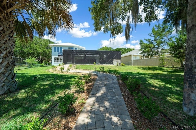 view of yard featuring a lanai