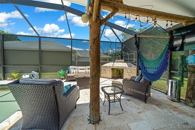 view of patio / terrace with glass enclosure and outdoor lounge area