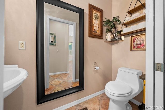 bathroom featuring tile patterned flooring and toilet