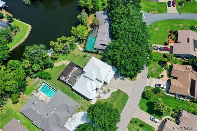 birds eye view of property with a water view