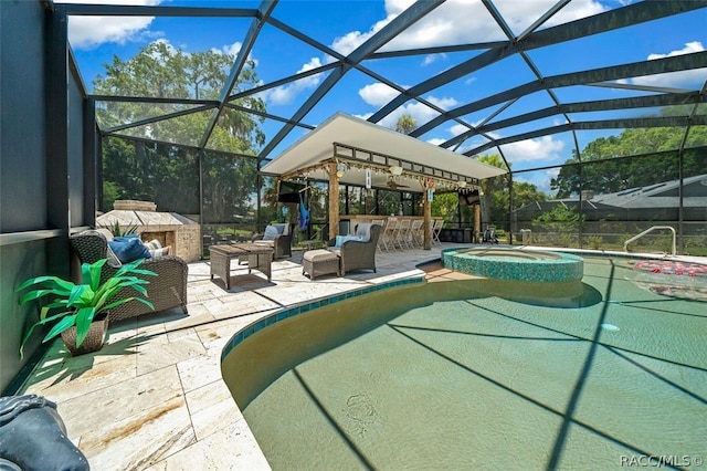 view of swimming pool with exterior bar, a lanai, and a patio area