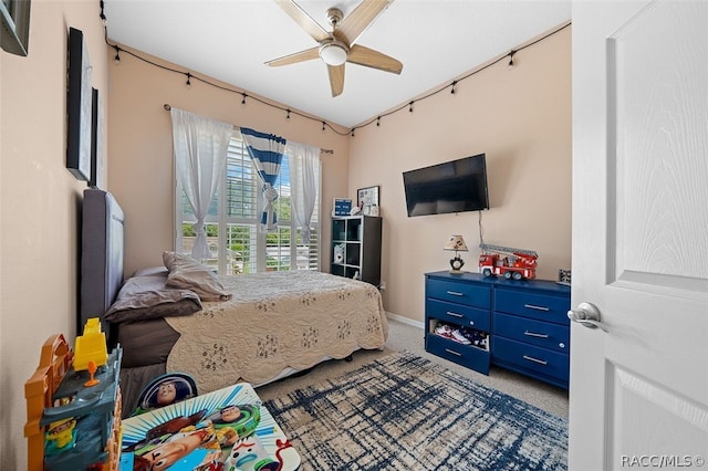 carpeted bedroom featuring ceiling fan