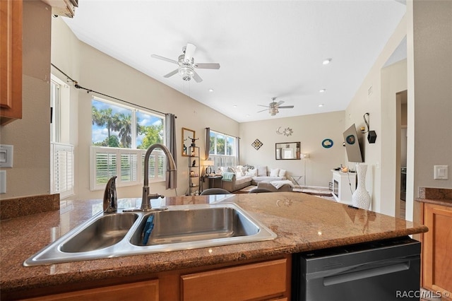 kitchen featuring dishwasher, sink, and ceiling fan