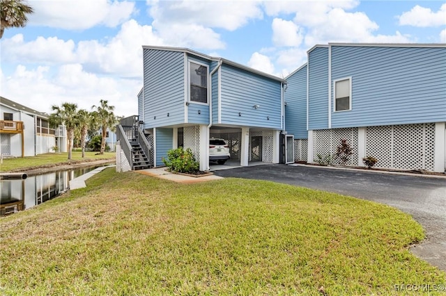 exterior space featuring a front lawn and a carport