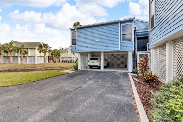 view of home's exterior with a carport