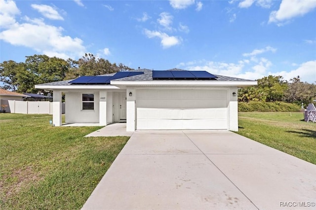 ranch-style house featuring stucco siding, concrete driveway, an attached garage, a front yard, and fence