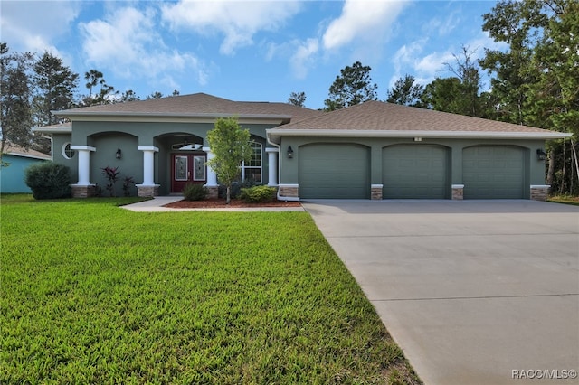 view of front facade featuring a garage and a front yard