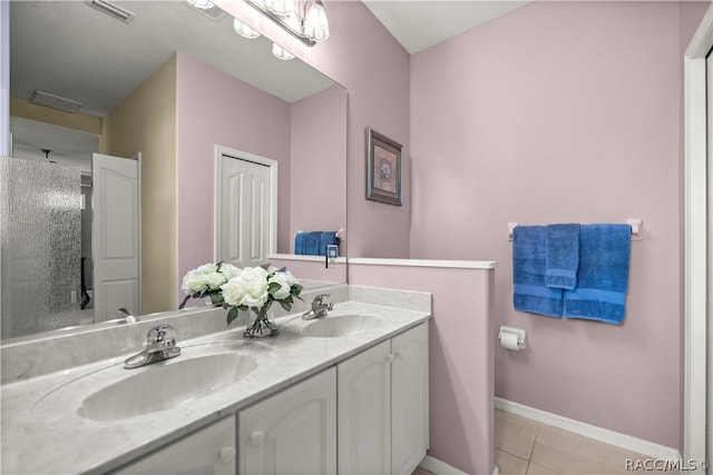 bathroom featuring tile patterned floors and vanity