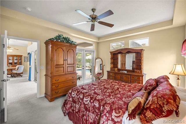 carpeted bedroom with ceiling fan, access to exterior, and french doors