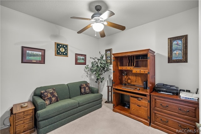 carpeted living room featuring ceiling fan