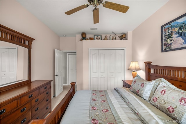 carpeted bedroom featuring ceiling fan and a closet