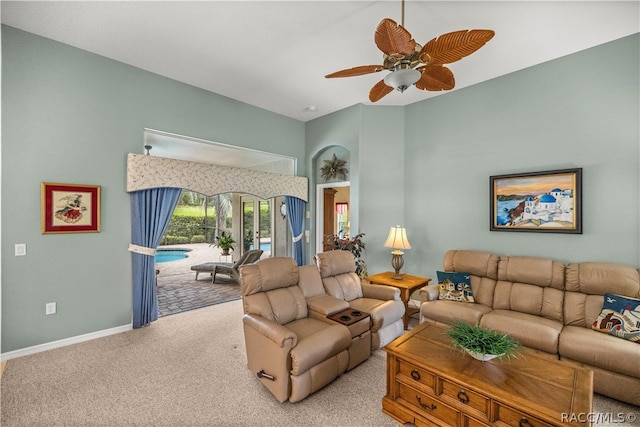 living room featuring ceiling fan and light carpet