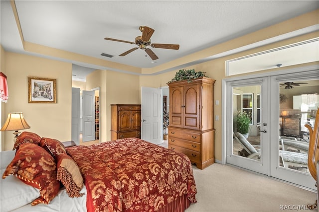 bedroom with ceiling fan, light colored carpet, access to outside, and french doors