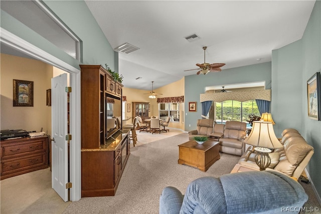 carpeted living room featuring lofted ceiling