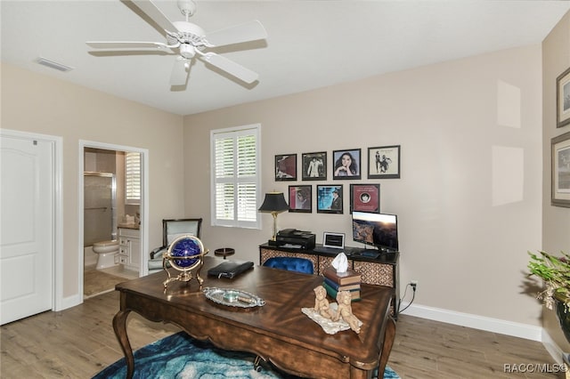 office space featuring hardwood / wood-style flooring and ceiling fan