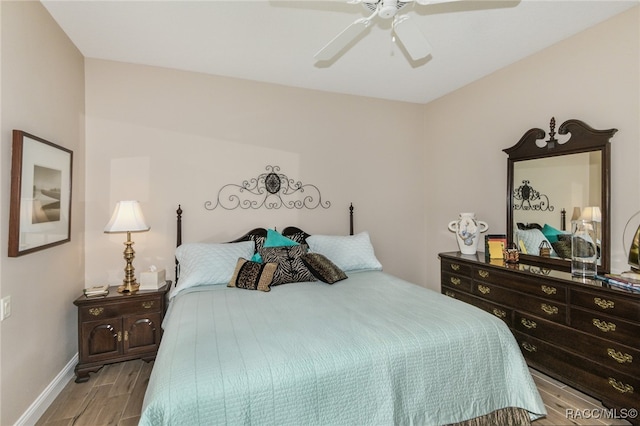 bedroom with light wood-type flooring and ceiling fan