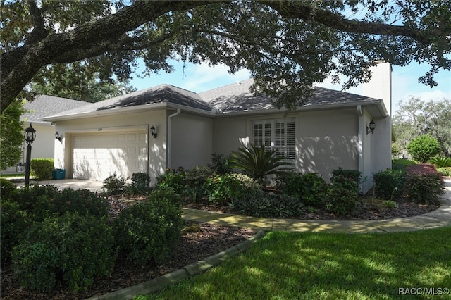 ranch-style house featuring a garage