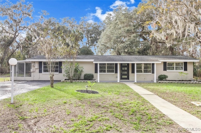 ranch-style house with a front lawn