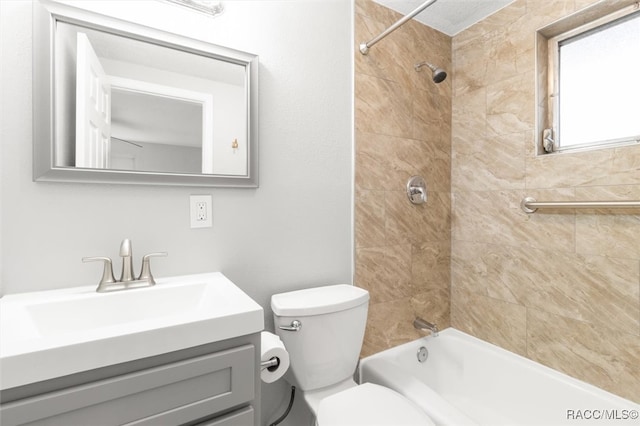 full bathroom featuring vanity, toilet, and tiled shower / bath