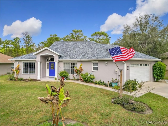 ranch-style house featuring a front yard and a garage