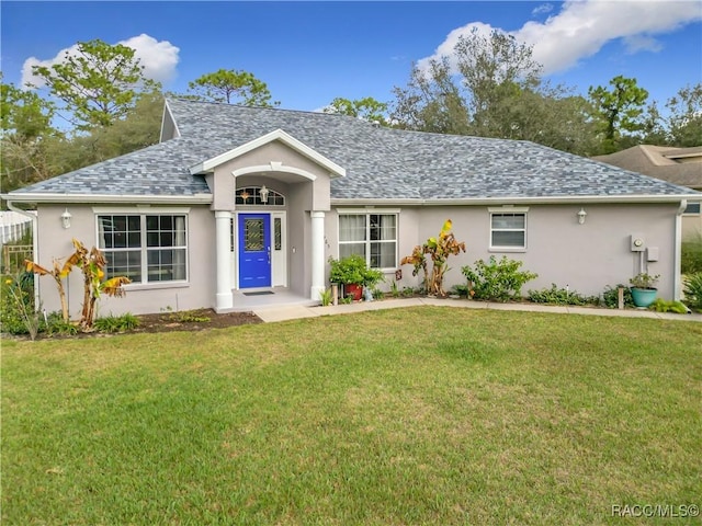 single story home with a front yard