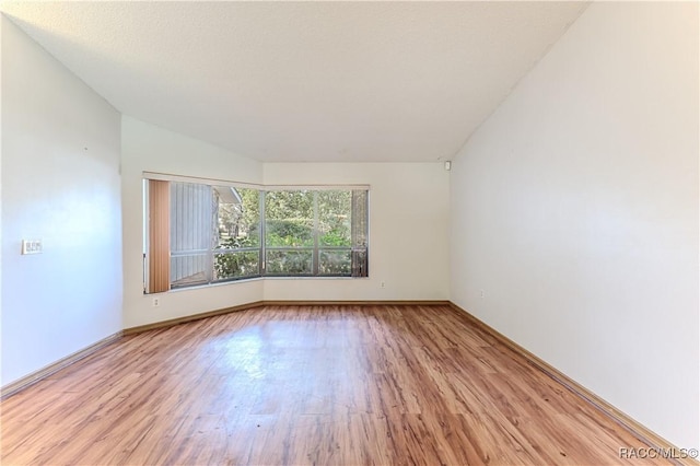 spare room with light wood-type flooring