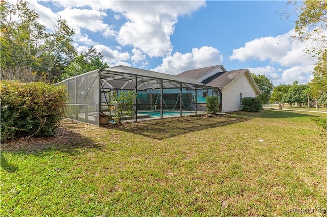 view of yard with glass enclosure