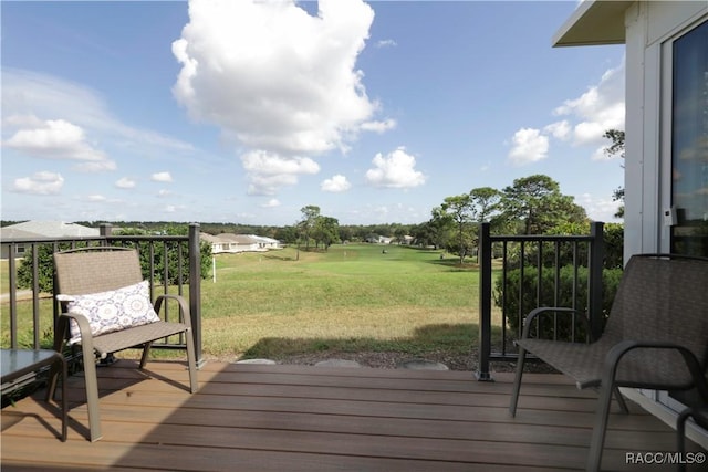 wooden terrace with a yard