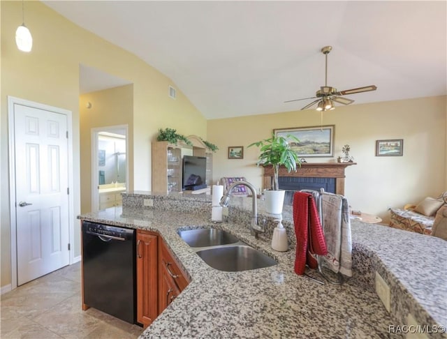 kitchen featuring dishwasher, sink, light stone counters, pendant lighting, and vaulted ceiling