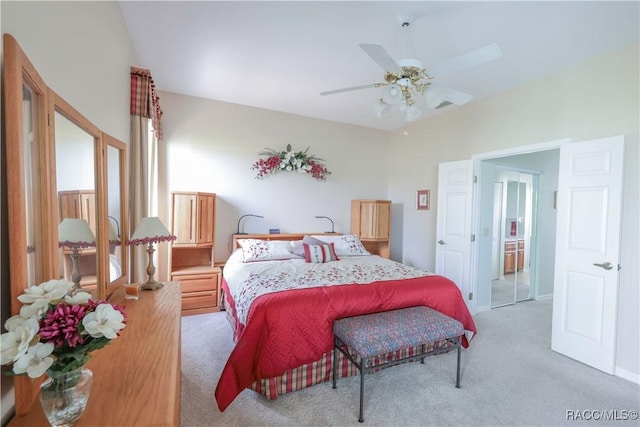 bedroom featuring ceiling fan, light colored carpet, and a closet