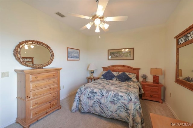 bedroom with ceiling fan and light colored carpet