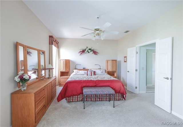 bedroom with light colored carpet and ceiling fan