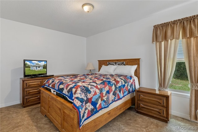 bedroom featuring light colored carpet