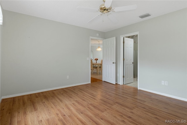 unfurnished room with ceiling fan and light wood-type flooring