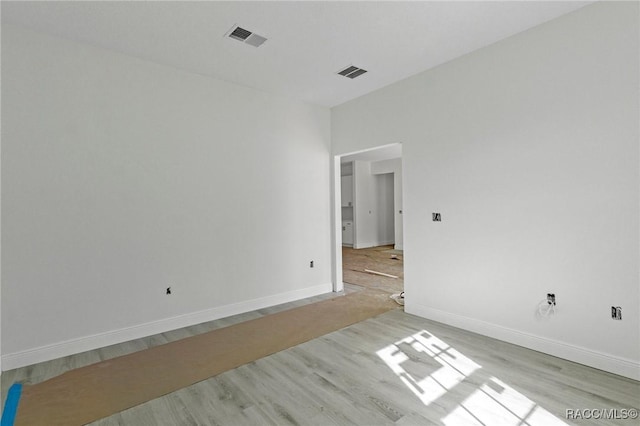 unfurnished room featuring light hardwood / wood-style flooring