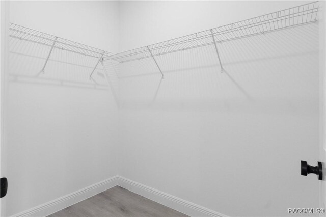 1083 W Cary Dr, Citrus Springs, FL 34434 - walk in closet with wood finished floors