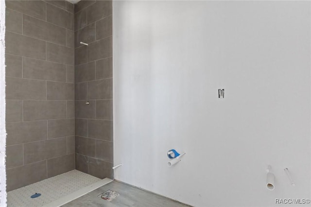 bathroom with a tile shower