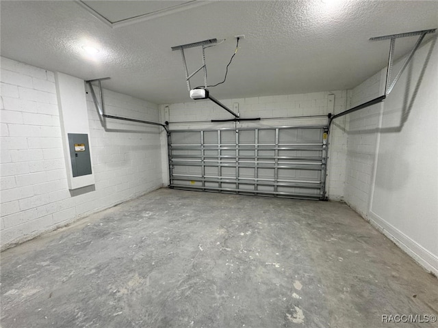 garage featuring electric panel and a garage door opener