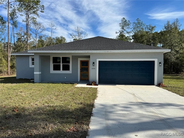 single story home with a garage and a front lawn