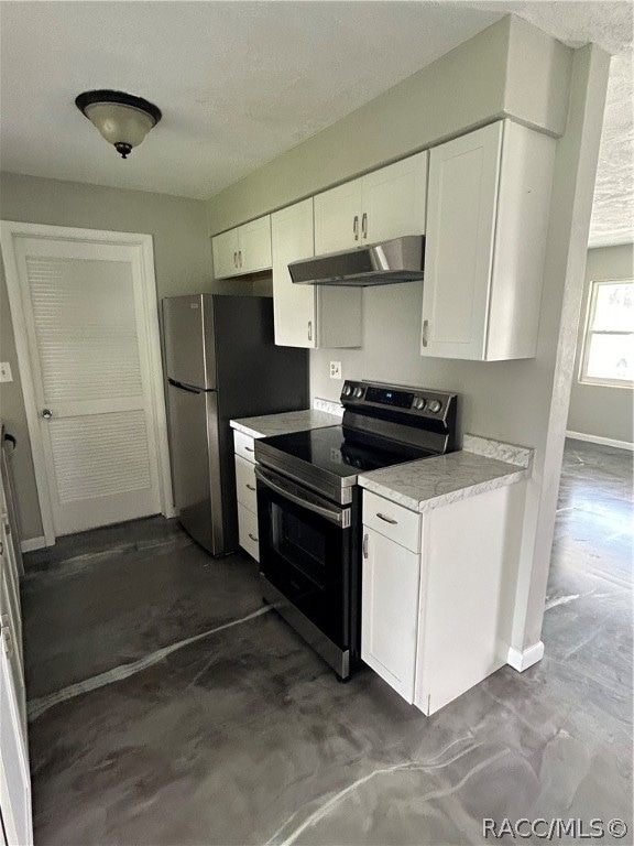 kitchen featuring white cabinets, stainless steel fridge, and range with electric stovetop