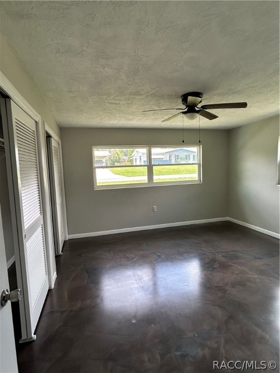 spare room with ceiling fan