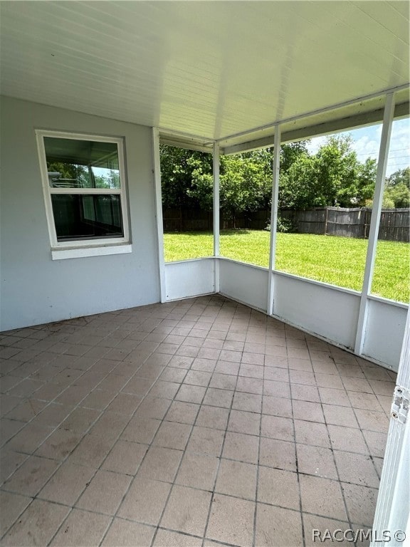 unfurnished sunroom featuring plenty of natural light