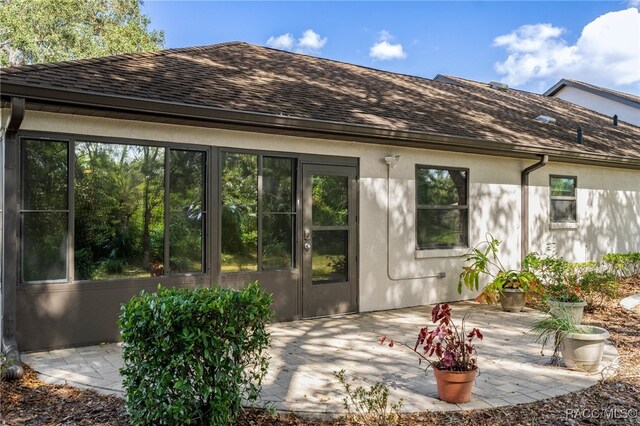 rear view of property featuring a patio