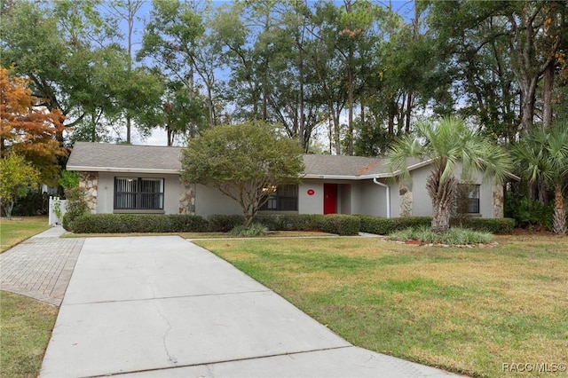 ranch-style house with a front yard